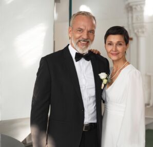 Senior Bride and Groom Posing Together in Church Interior