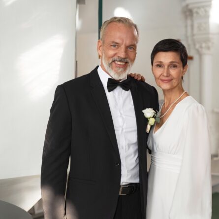 Senior Bride and Groom Posing Together in Church Interior